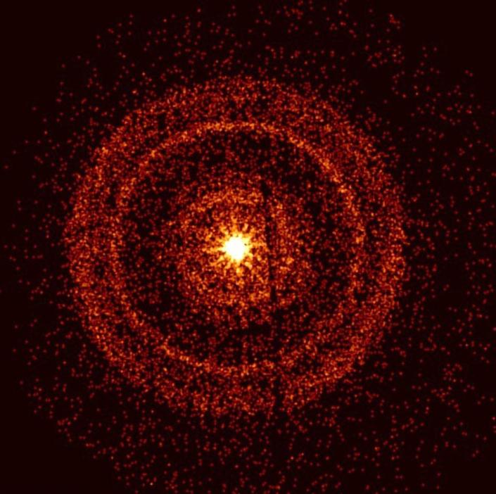 Los rayos gamma amarillos brillantes explotaron rodeados de anillos de puntos rojos